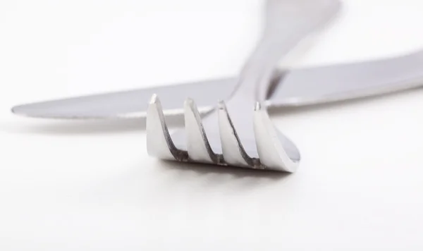 Fork and knife crossed over each other — Stock Photo, Image