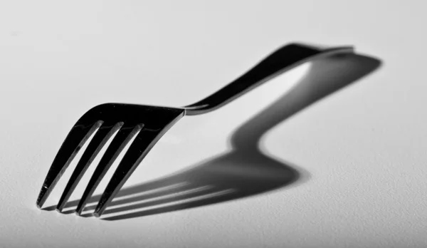 Fork on white surface — Stock Photo, Image