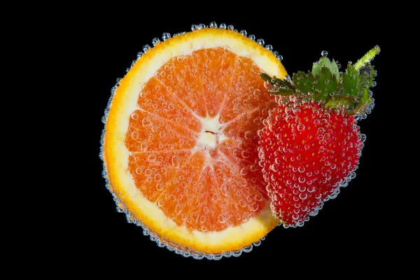 Fruit under water with bubbles — Stock Photo, Image