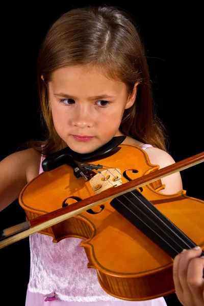 Girl playing violin in pink dress — Stok fotoğraf