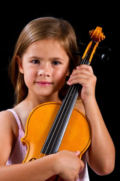 Girl holding violin in pink dress — Stock Photo, Image