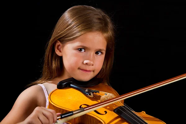 Girl playing violin in pink dress — Stock Photo, Image