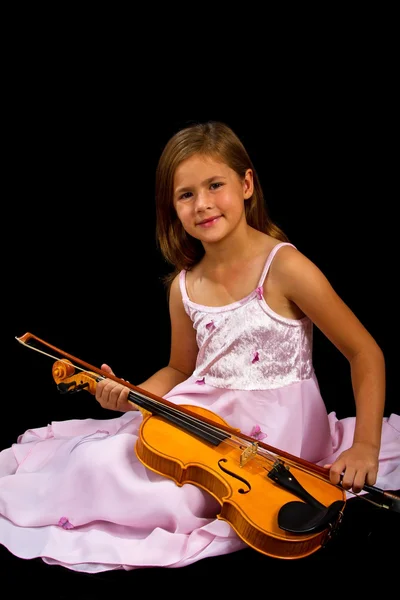 Girl holding violin in pink dress — Stock Photo, Image