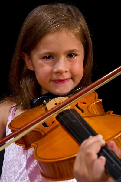 Girl playing violin in pink dress — Stock Photo, Image