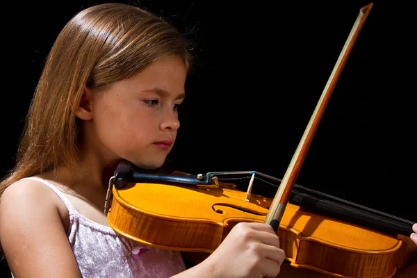 Girl playing violin in pink dress — Stok fotoğraf
