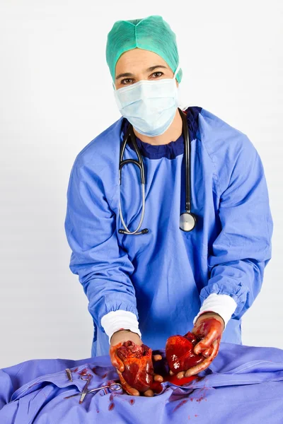 Doctor hold two hearts in blue — Stock Photo, Image