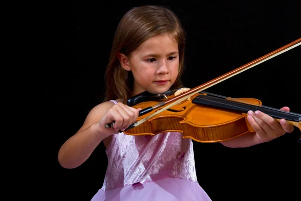 Girl playing violin in pink dress — Stock Photo, Image