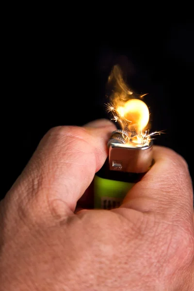 Hand with lighrt igniting close-up — Stock Photo, Image