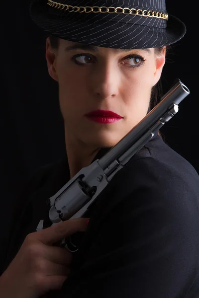 Dangerous woman in black with silver handgun — Stock Photo, Image