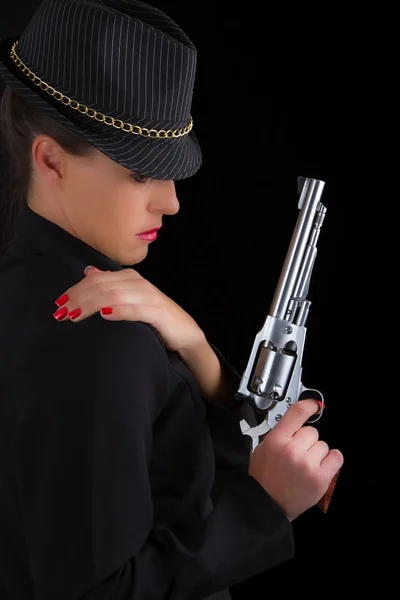 Dangerous woman in black with silver handgun — Stock Photo, Image