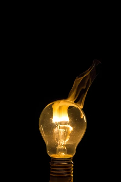 Broken light bulb burn out with flame — Stock Photo, Image