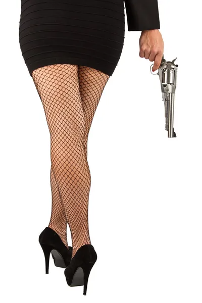 Legs of dangerous woman with handgun and black shoes — Stock Photo, Image