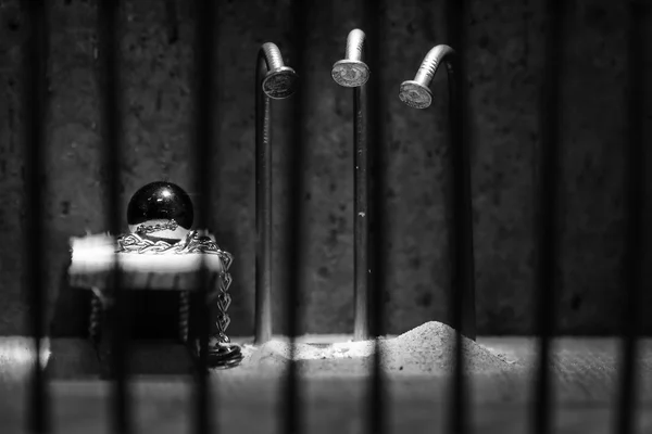 Conceptual jail photo with iron nail escaping behind out of focu — Stock Photo, Image