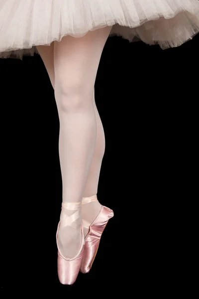 Ballet dancer standing on toes while dancing in pink tutu — Stock Photo, Image