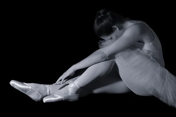 Female dancer sit on floor looking sad in artistic conversion — Stock Photo, Image