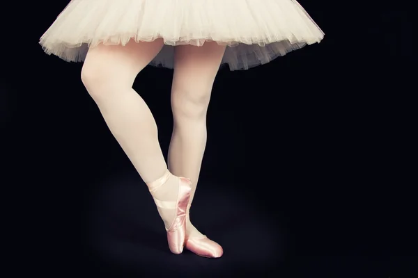 A ballet dancer standing on toes while dancing artistic conversi — Stock Photo, Image