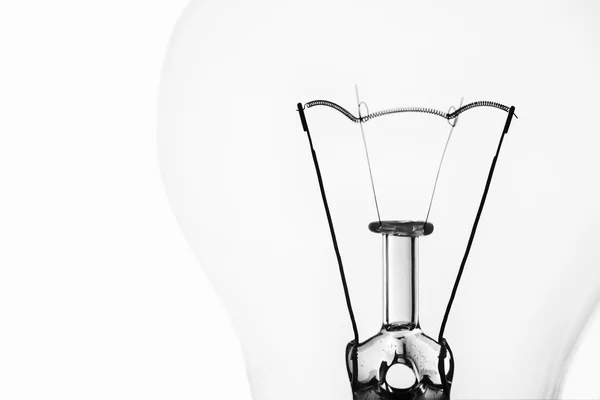 Light bulb macro with the filament wire and construction artisti — Stock Photo, Image