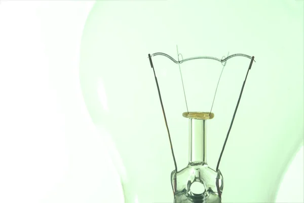 Light bulb macro with the filament wire and construction artisti — Stock Photo, Image