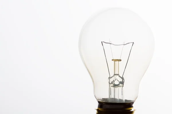 Light bulb macro with the filament wire and construction artisti — Stock Photo, Image