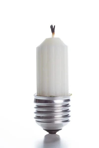 Light bulb fitting with no glass and candle standing on bright w — Stock Photo, Image