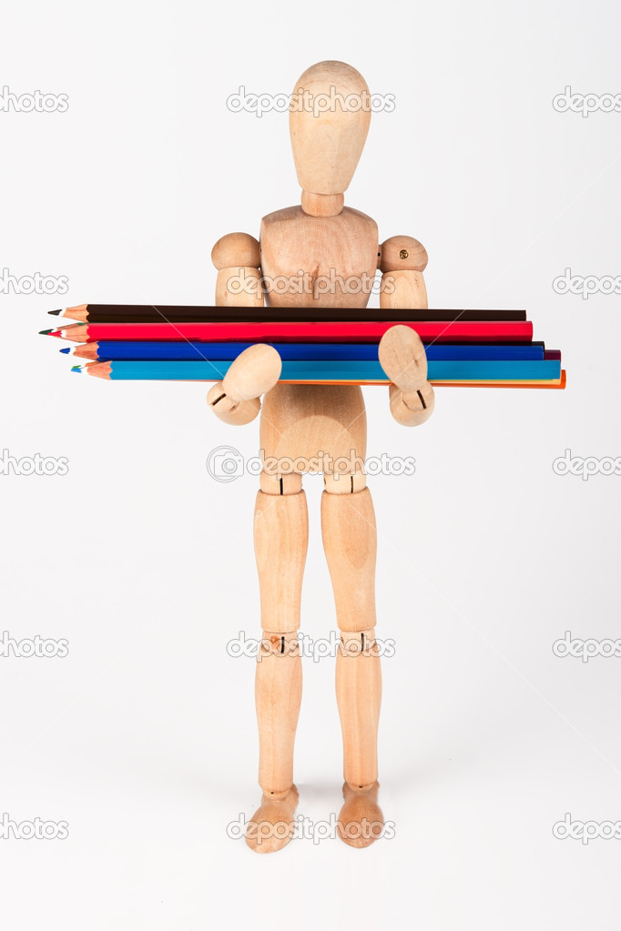 Small wood mannequin standing with bunch of colour pencil isolat