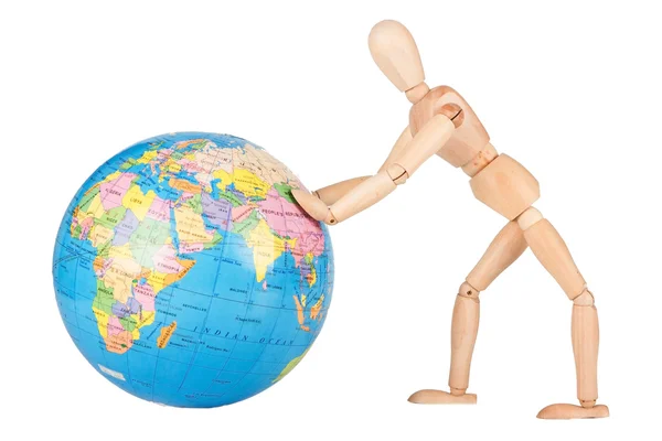 Wood mannequin push a world globe in disrespect isolated — Stock Photo, Image