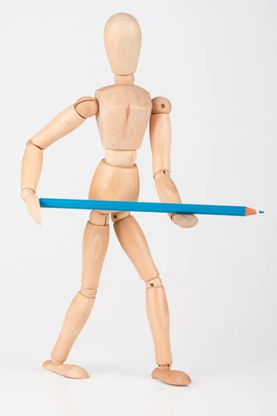 Small wood mannequin standing with colour pencil isolated on whi — Stock Photo, Image