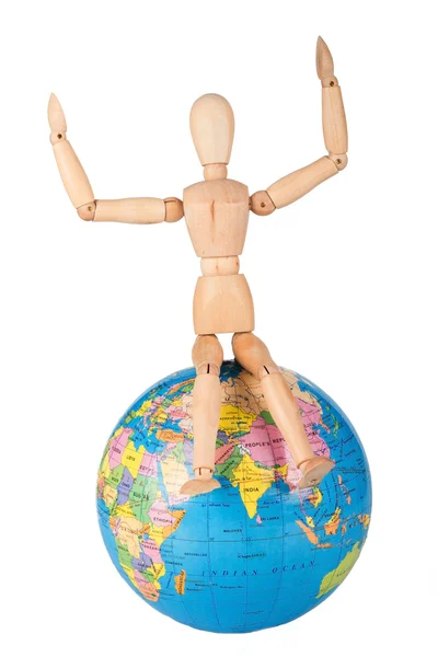 Wood mannequin sitting on top of a world globe to protect isolat — Stock Photo, Image