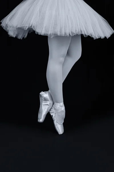 A ballet dancer standing on toes while dancing artistic conversi — Stock Photo, Image