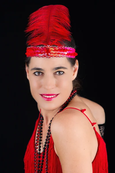 Young beautiful brunette in 1920 style attire red dress and a fe — Stock Photo, Image