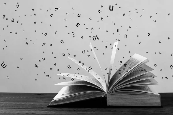 Open Book Spilling Out Letters Surroundings — Foto Stock
