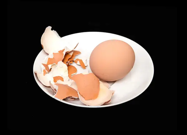 Chicken egg on a black background — Stock Photo, Image