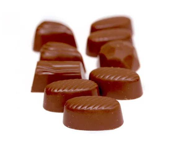 Beyaz arka planda izole çikolatalar — Stok fotoğraf