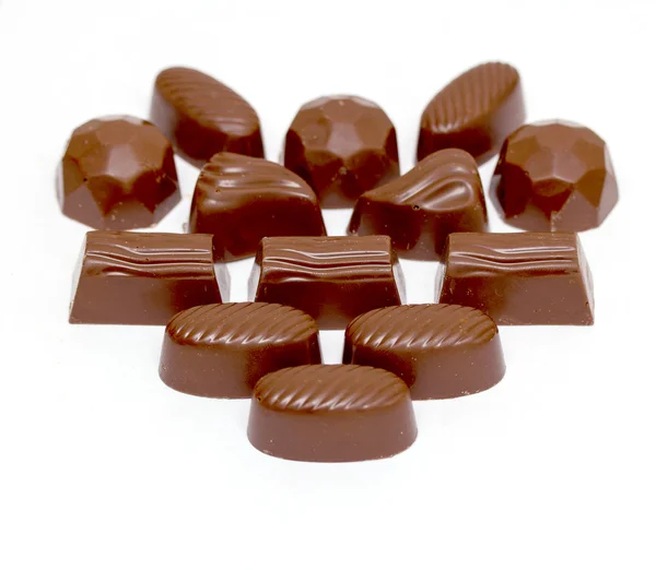 Beyaz arka planda izole çikolatalar — Stok fotoğraf