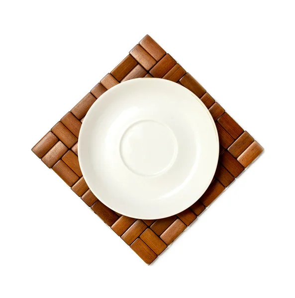 White plate on a wooden decorative background — Stock Photo, Image