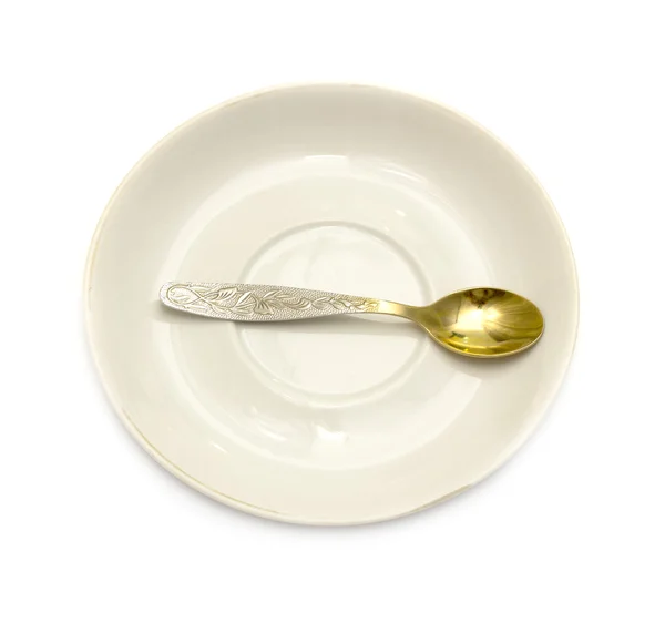Primer plano de cuchara y plato sobre fondo blanco — Foto de Stock