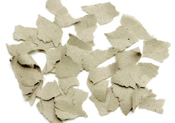 Bitar av papper på en vit bakgrund — Stockfoto