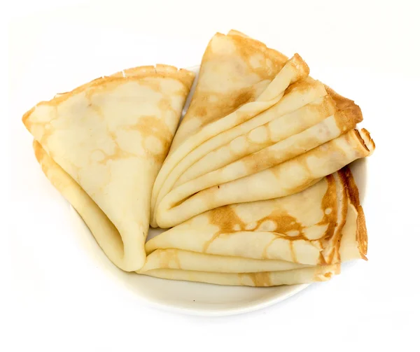 Un sacco di pancake su un piatto isolato su sfondo bianco — Foto Stock