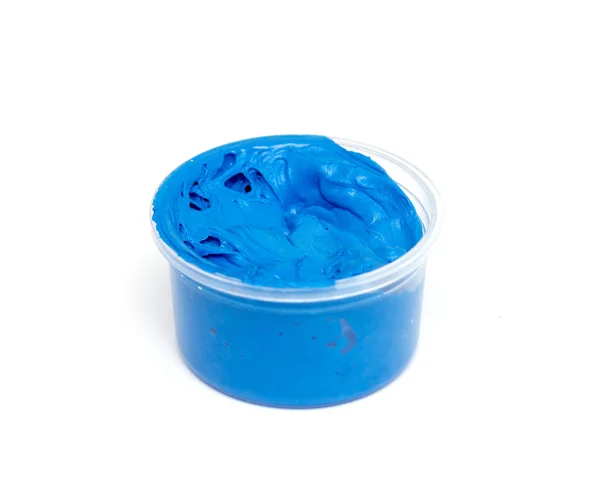 Blue oil paint in a plastic container — Stok fotoğraf