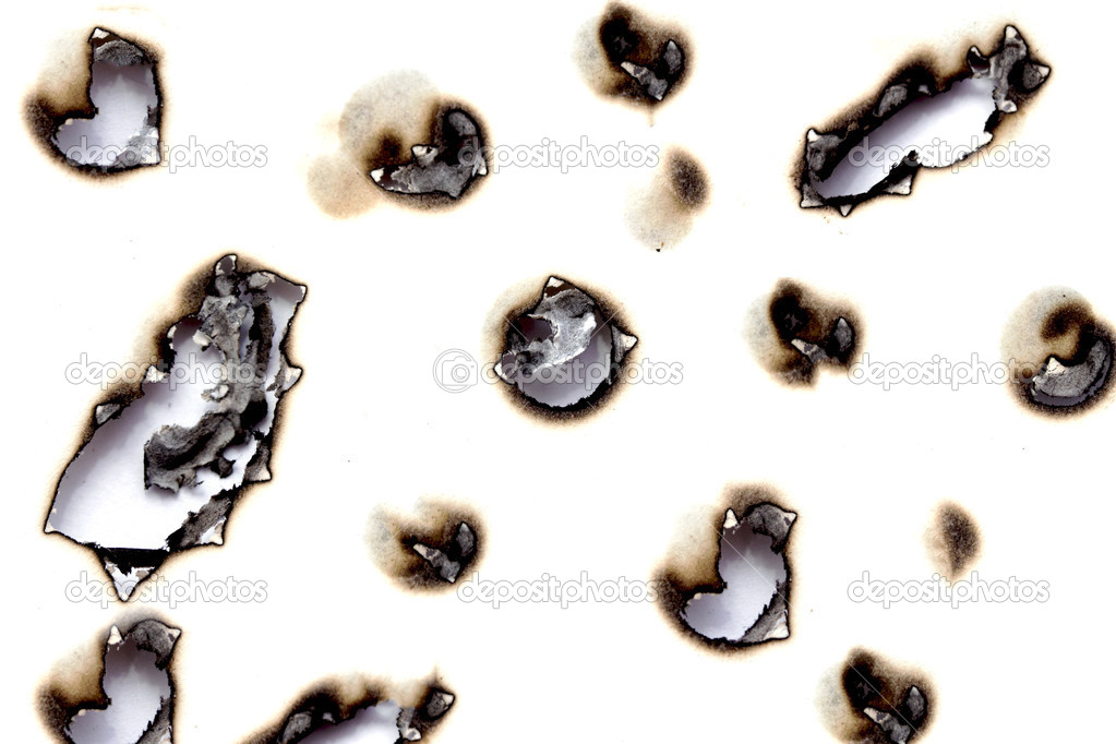 Burnt holes in a piece of paper