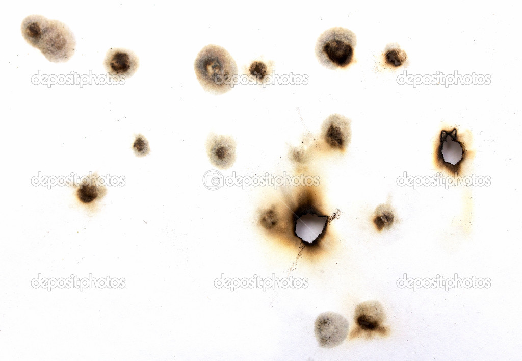 Burnt holes in a piece of paper