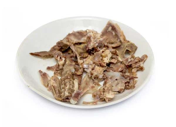 Picked chicken bones on plate — Stock Photo, Image