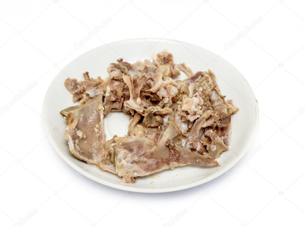 Picked chicken bones on plate
