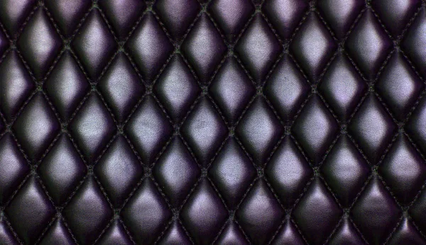 Black quilted leather background — Stock Photo, Image