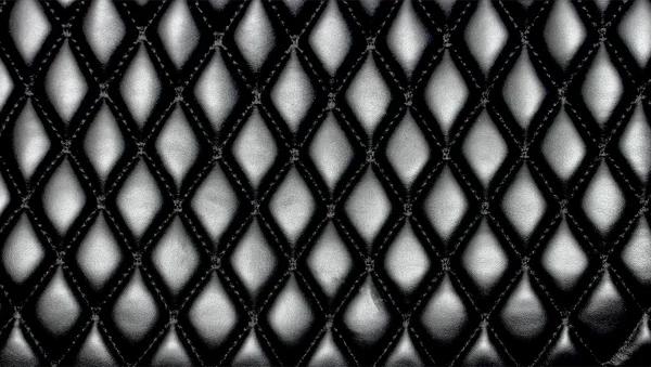 Black quilted leather background — Stock Photo, Image
