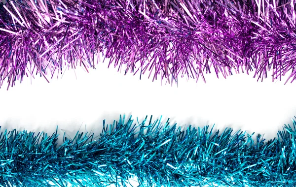 Christmas blue and purple tinsel streamers — Stock Photo, Image