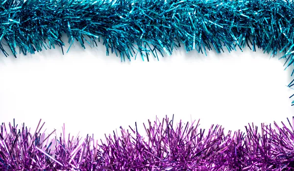Christmas blue and purple tinsel streamers — Stock Photo, Image
