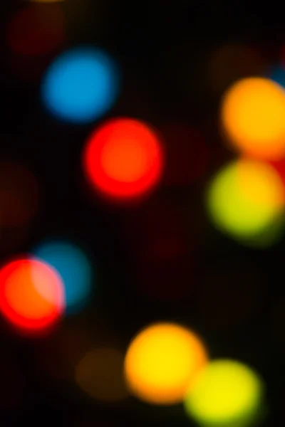 Holiday bokeh blurred on a dark background — Stock Photo, Image