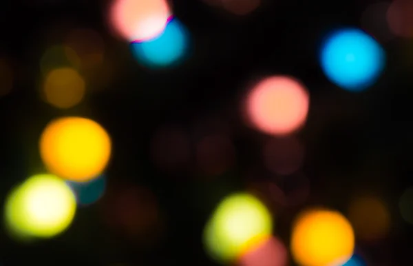 Holiday bokeh blurred on a dark background — Stock Photo, Image