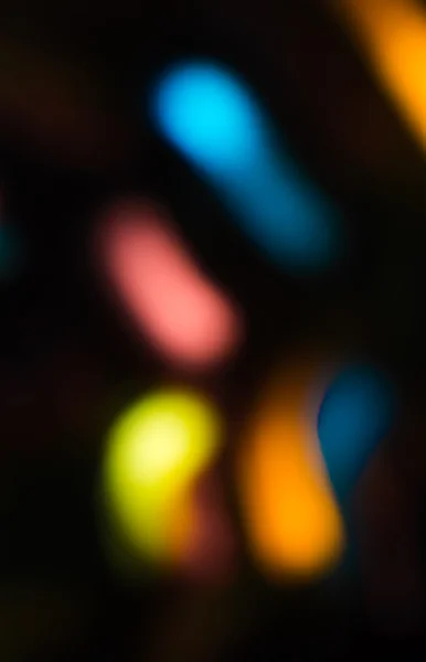 Holiday bokeh blurred on a dark background — Stock Photo, Image